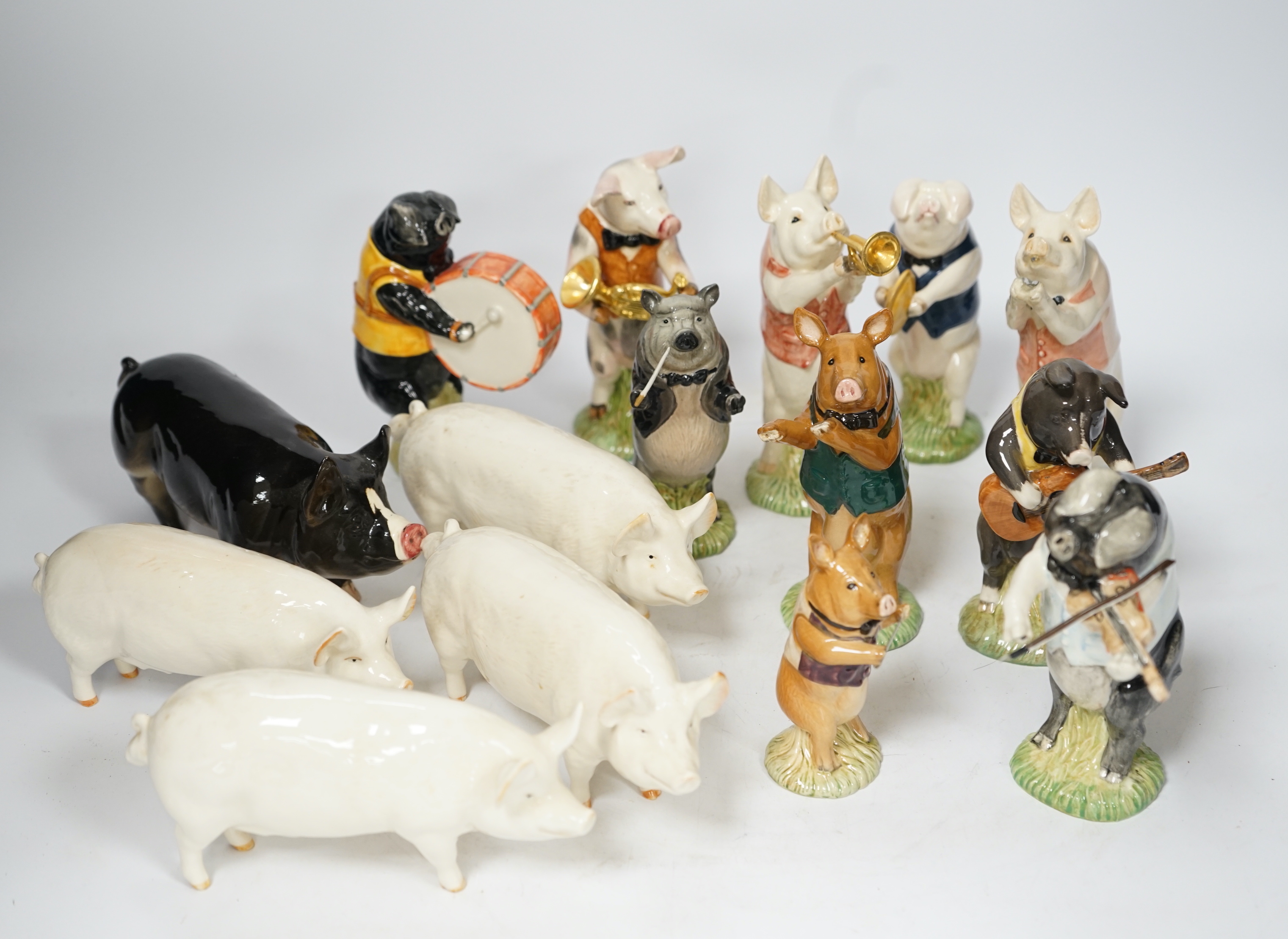 Five Beswick pigs and ten Beswick pig musician band figures